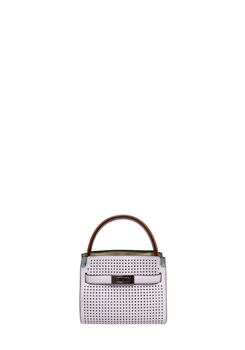 Tory Burch Lee Radziwill petite white perforated leather satchel with structured top handle and signature silver-tone belt lock closure.