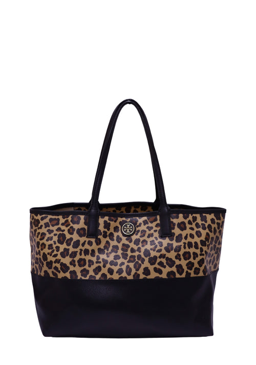 Tory Burch leopard print tote bag featuring a beige and black animal print canvas upper, black leather base and shoulder straps, gold-tone Tory Burch logo medallion, open-top design, and a spacious structured silhouette