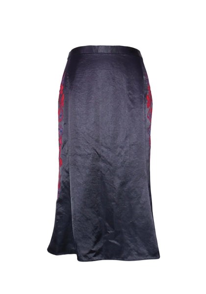 Tory Burch navy satin midi skirt with red floral embroidery along the side, featuring a fitted silhouette and slight flare hem