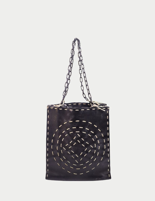 Valentino black leather tote bag with white stitched circular pattern, silver-tone chain straps, and open top design