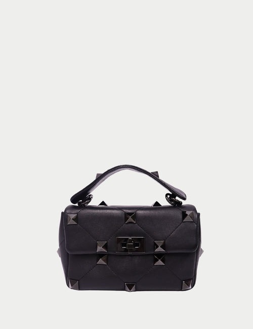 Valentino Garavani Rockstud Spike black leather bag with quilted stitching, pyramid studs, and top handle