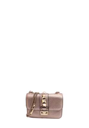Valentino Garavani metallic rose gold mini crossbody bag with Rockstud embellishments, gold-tone chain strap, and flap-front push-lock closure.