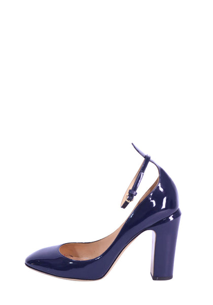 Valentino navy patent leather pumps featuring a glossy finish, round toe, adjustable ankle strap, and chunky block heel