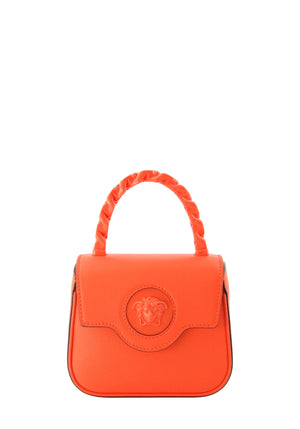 Versace Le Medusa neon orange mini leather top handle bag with embossed Medusa logo and braided handle.