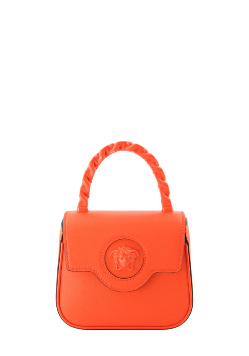 Versace Le Medusa neon orange mini leather top handle bag with embossed Medusa logo and braided handle.