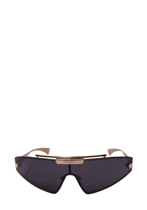 Versace black futuristic shield sunglasses featuring dark smoke angular lenses, a gold-tone metal brow bar with engraved Versace logo, gold-tone side accents and slim curved temples