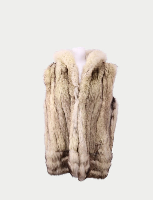 Beige fur vest with plush texture displayed on mannequin