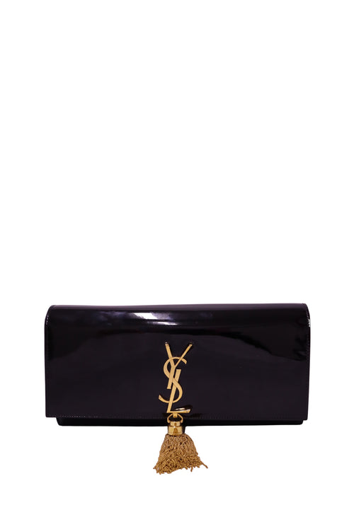 Authentic Saint Laurent Kate black patent leather clutch featuring the iconic gold YSL Cassandre logo and signature gold chain tassel.
