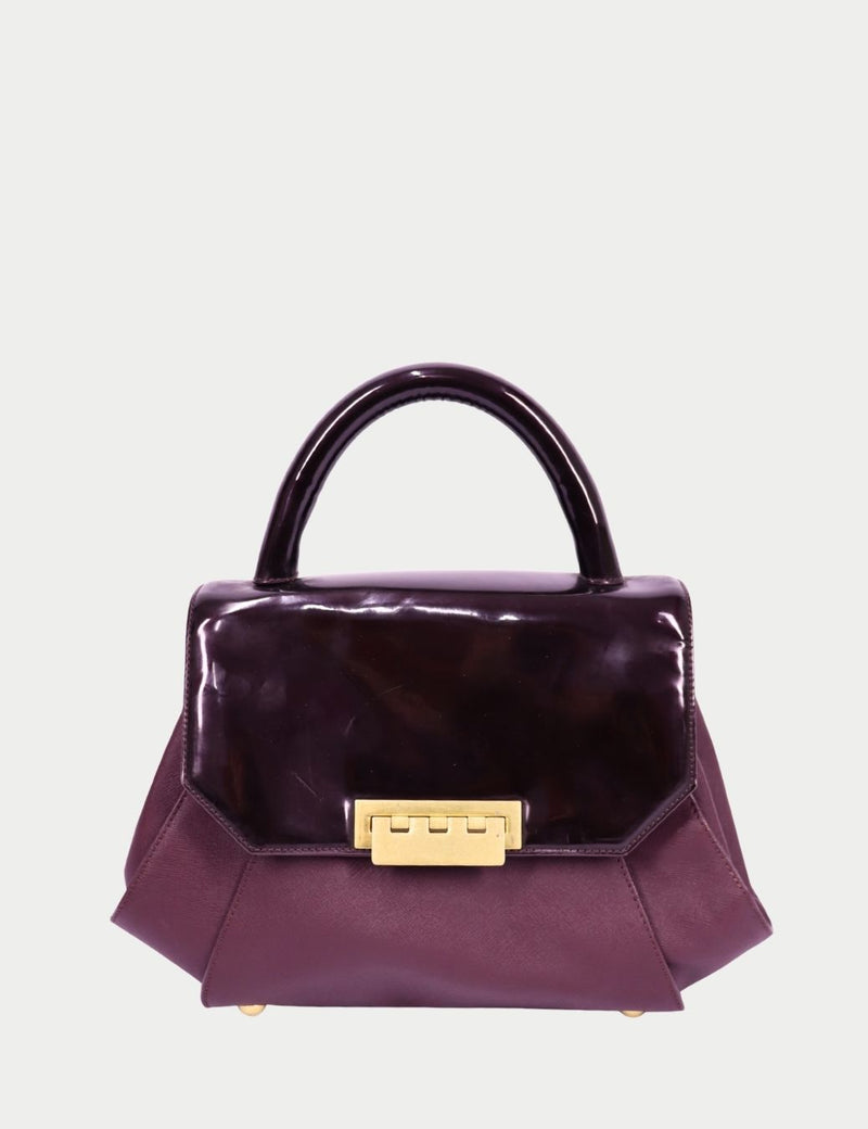 Zac Posen burgundy structured top handle handbag with glossy leather flap and gold tone clasp