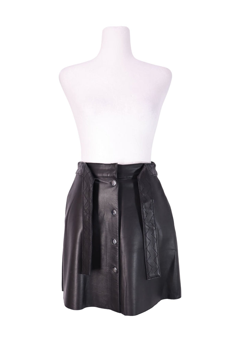 Maje black leather mini skirt with button-front closure and braided waist detailing.