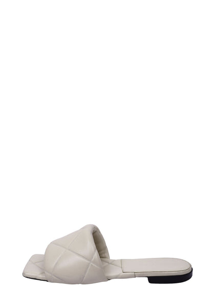 Authentic Bottega Veneta white quilted leather flat slides with padded wide strap and square toe design.