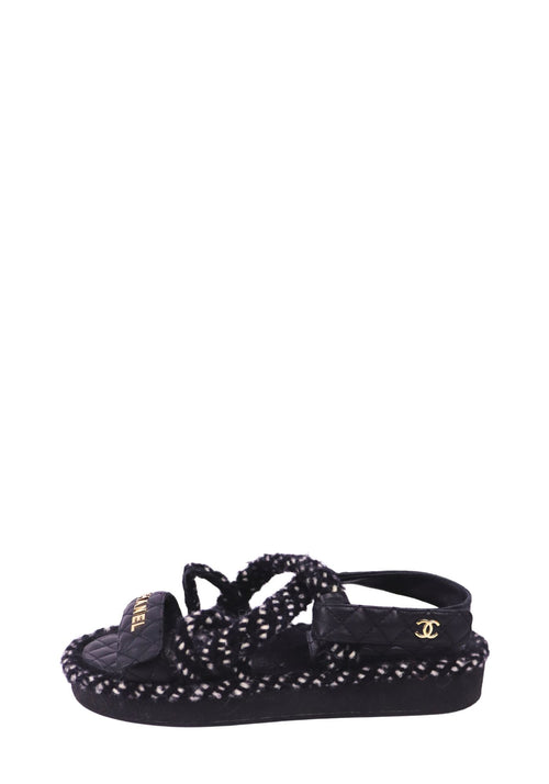 Chanel black quilted sport sandals with gold logo detailing and textured black-and-white woven trim