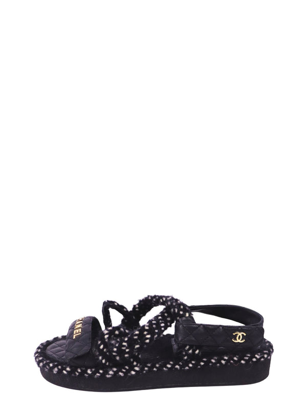 Chanel black quilted sport sandals with gold logo detailing and textured black-and-white woven trim
