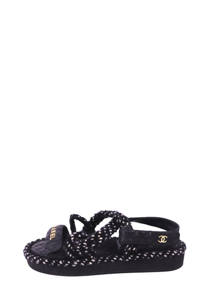 Chanel black quilted sport sandals with gold logo detailing and textured black-and-white woven trim