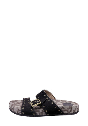 Authentic Coach slide sandals with signature monogram canvas footbed, black studded suede straps, and buckle detail.