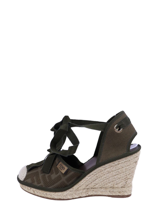 Fendi FF monogram olive canvas espadrille wedges with ribbon lace-up ties and braided jute wedge soles.