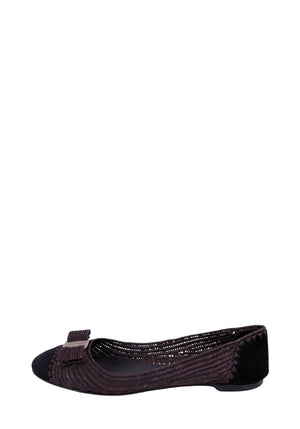 Salvatore Ferragamo dark brown woven ballet flats with round toe, signature grosgrain bow detail, and low flat heel, featuring textured raffia-style upper and leather trim.
