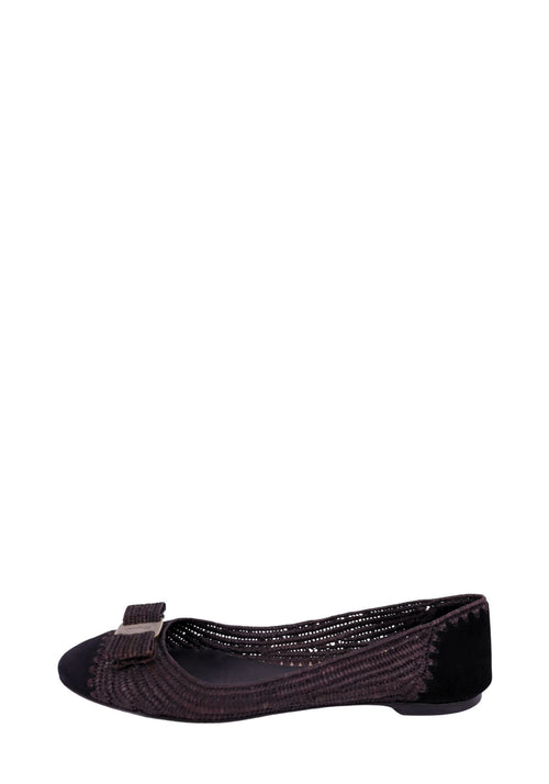 Salvatore Ferragamo dark brown woven ballet flats with round toe, signature grosgrain bow detail, and low flat heel, featuring textured raffia-style upper and leather trim.