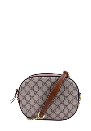 Gucci GG Supreme mini crossbody bag in beige monogram canvas with brown leather trim and gold-tone chain strap.
