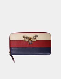 Gucci tricolor leather zip wallet with crystal-embellished bee and gold-tone hardware.

