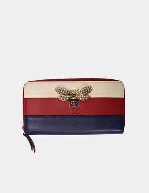 Gucci tricolor leather zip wallet with crystal-embellished bee and gold-tone hardware.

