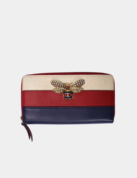 Gucci tricolor leather zip wallet with crystal-embellished bee and gold-tone hardware.

