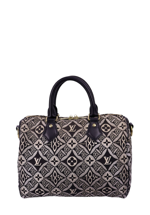 Louis Vuitton Speedy Bandoulière bag in black and beige jacquard monogram with leather handles and gold hardware