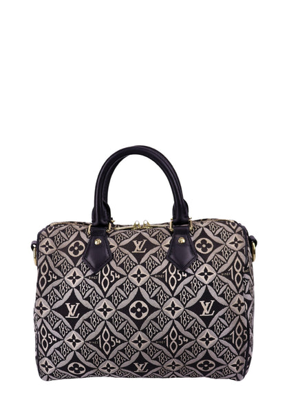 Louis Vuitton Speedy Bandoulière bag in black and beige jacquard monogram with leather handles and gold hardware