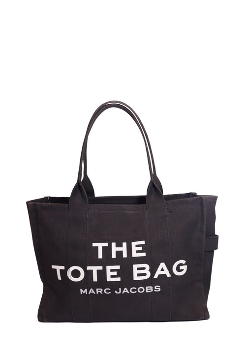 Authentic Marc Jacobs The Large Tote Bag in black canvas featuring the signature white logo print, spacious interior, and dual top handles.