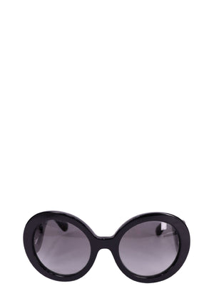 Prada black baroque sunglasses with oversized round lenses