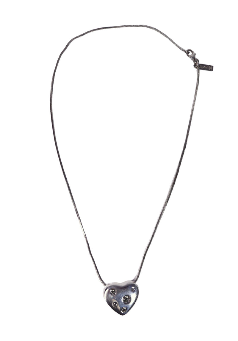 Saint Laurent silver tone heart pendant necklace with crystal embellishments and fine chain detailing.