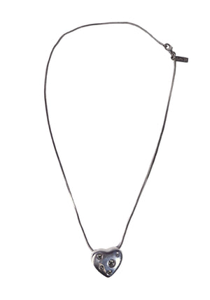 Saint Laurent silver tone heart pendant necklace with crystal embellishments and fine chain detailing.