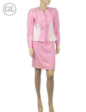 Escada Couture pink two-piece skirt suit with pearl-accented buttons and white panel detailing.

